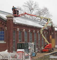 Worker installing glass on the Linnean House