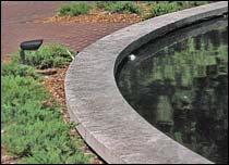 Capstone ledge around pond